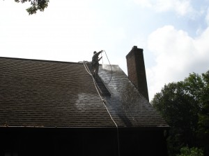 Roof washing in progress by the house washing experts at Kevin Palmer Painting, serving the towns of Avon CT, Canton CT, Farmington CT, Granby CT, Simsbury CT, and West Hartford CT for nearly a half century. 