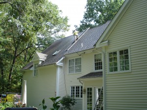 Unsightly and damaging roof stains will be thoroughly and safely removed after the roof washing technicians of Kevin Palmer Painting complete their work on this Granby, CT home.